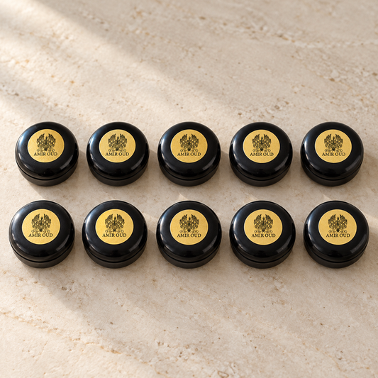 Ten Amir Oud solid perfume samples in black 3 g pots with gold labels